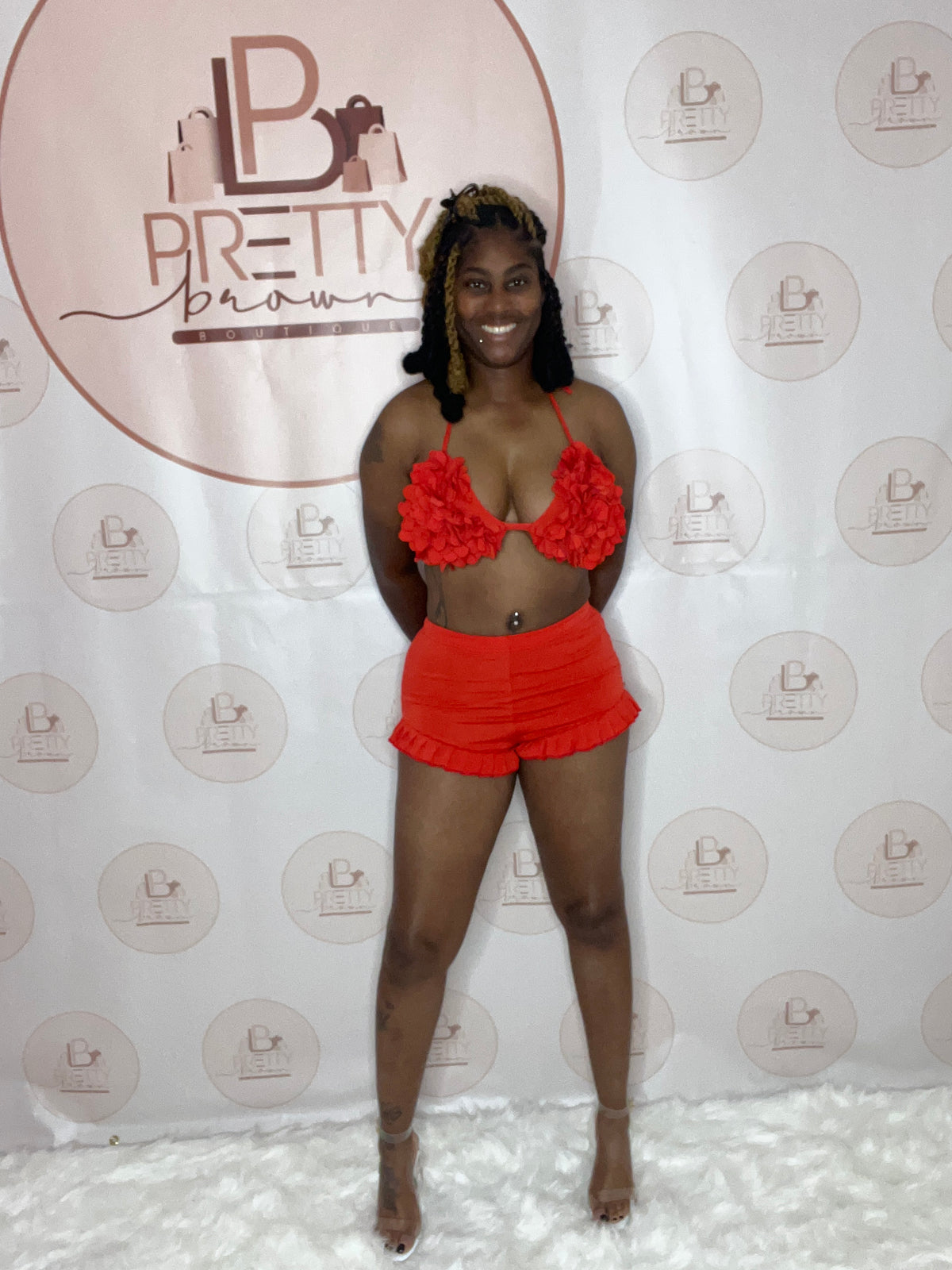 A red bra and shorts set with a lace-up design and ruffle details—perfect for a fun, flirty vibe.

