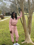 Stay cozy in this pink jogger set—perfect for comfort and style all season long.