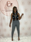 The Khatie Jumpsuit is a sleek and edgy look for any occasion.

-Black and white color scheme
-Mesh see-through top