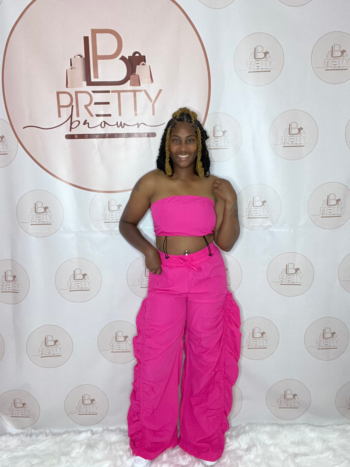 The Pink Barbie Set is all about fun, bold, and chic vibes! This hot pink two-piece set includes a cropped top and wide-leg, pleated pants for that easy, breezy feel with a little extra style.