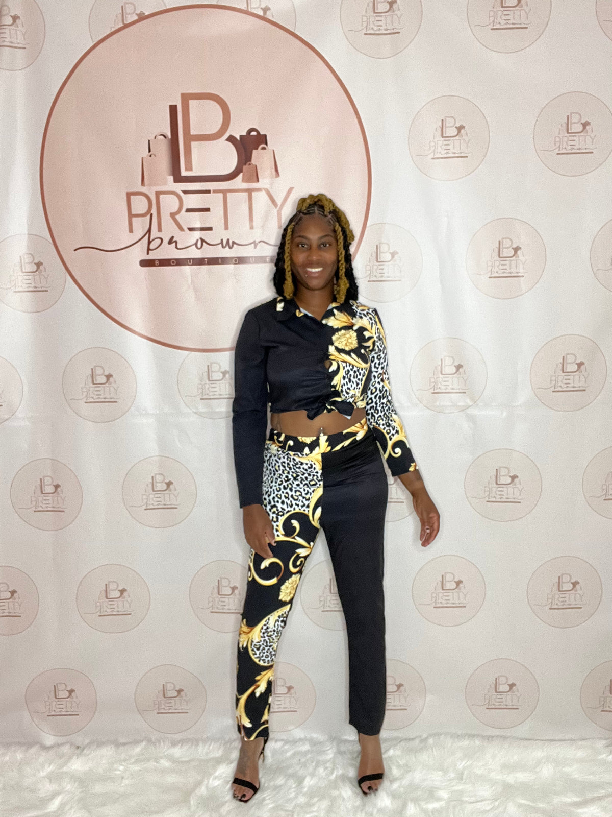 This 2-piece set is giving all the royalty vibes! The black, white, and gold colors with abstract print are made to stand out. Perfect for hitting the club or a night out, you’ll be turning heads all night long.

Available in S, M, L, & XL
Stretchy & flattering fit
Abstract royalty print
Crop top & high-waist skirt