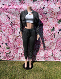 Keep it cute and comfy in this two-piece set! The cropped top with long sleeves and a zipper closure pairs perfectly with the high-waisted joggers featuring an elastic waistband, drawstrings, and pockets.

-Cropped top with long sleeves
-Zipper closure
-High-waisted joggers
-Elastic waistband &amp; drawstrings
-Pockets