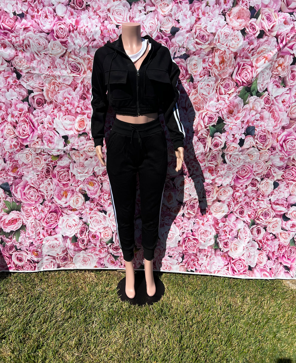 The Trysta Pant Set is your go-to for comfy, laid-back vibes with a twist! This two-piece set comes with a cropped hoodie featuring long sleeves and a zipper closure, paired with high-waisted joggers that have an elastic waistband, drawstrings, and pockets. The cuffed bottoms add the perfect touch of style.
