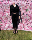The Trysta Pant Set is your go-to for comfy, laid-back vibes with a twist! This two-piece set comes with a cropped hoodie featuring long sleeves and a zipper closure, paired with high-waisted joggers that have an elastic waistband, drawstrings, and pockets. The cuffed bottoms add the perfect touch of style.