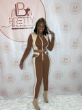 The Night Strut Pant Set is giving major vibes! This set features a cropped, long-sleeve zipper top and legging pants in a stylish brown and beige color combo. Perfect for those nights when you want to look effortlessly chic and comfy.