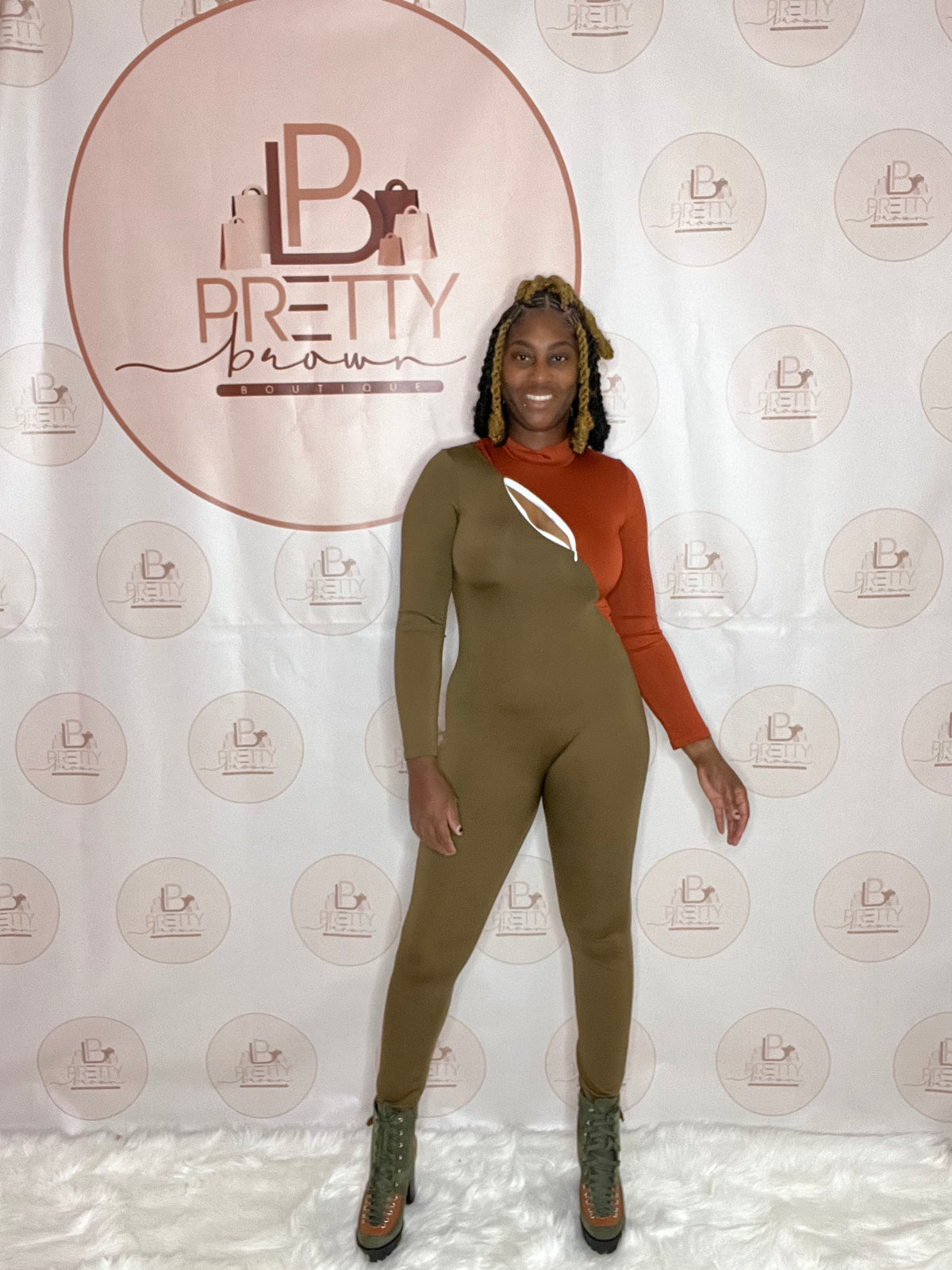 The Keyhole Sexy Bodycon Jumpsuit is here to slay! This green and orange jumpsuit hugs your curves perfectly, with a bold keyhole cutout that adds a little extra. 
