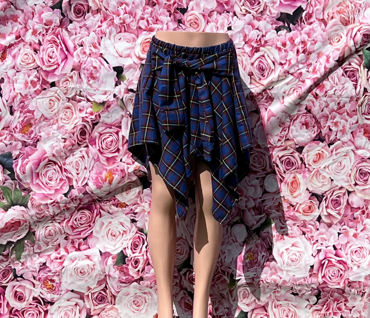 The Joyce Babe Skirt is your new go-to for a cozy, stylish look.

-Flannel fabric for comfort and warmth
-Elastic waistband with a self-tie waist
-No closure for easy wear
-65% polyester, 35% cotton