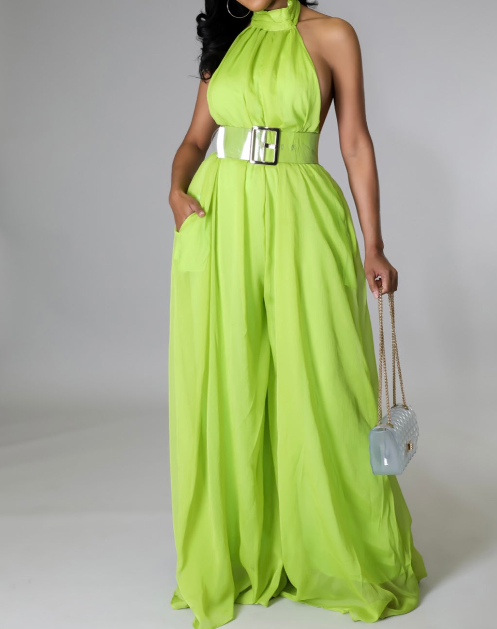 A lime green flowy wide-leg jumpsuit with a sexy curvy upper body fit—perfect for turning heads and making a statement.


