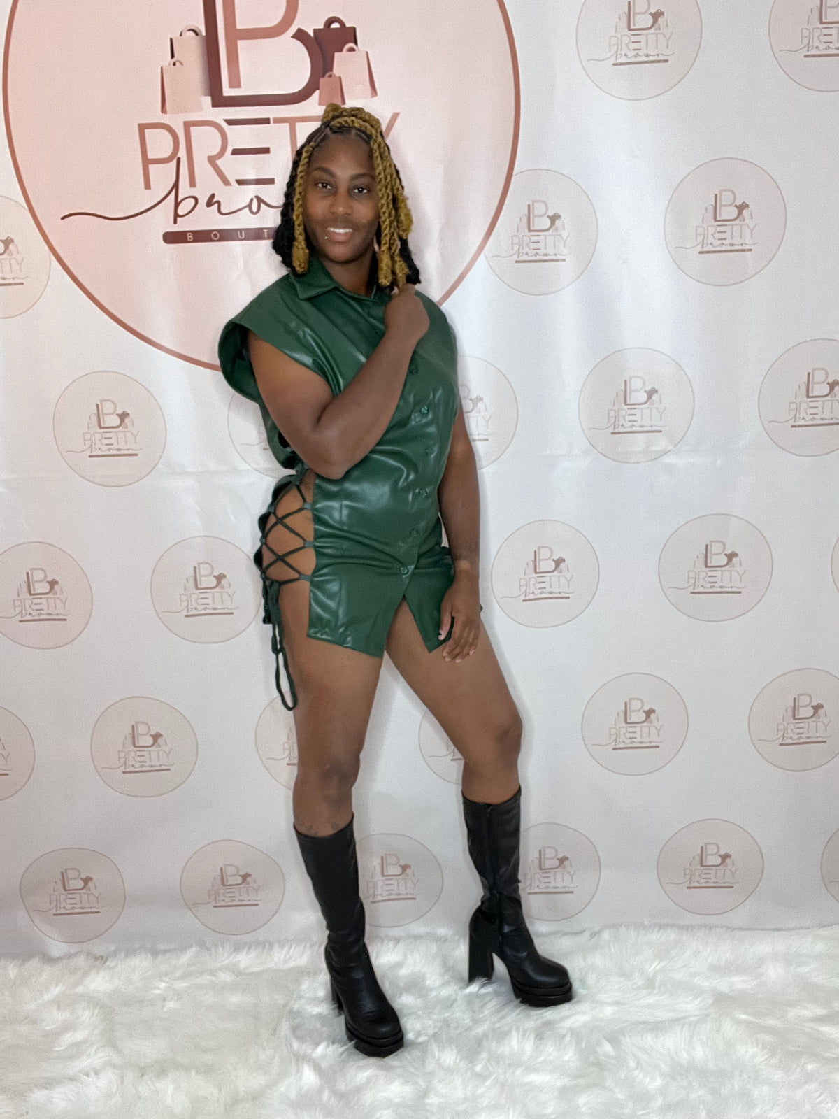 The dress is giving bold and sexy! This faux leather dress brings all the details with side cutouts, lace-up sides, and a self-tie closure for the perfect fit.

-Collar neckline
-Sleeveless
-Side cutouts &amp; lace-up detail
-Self-tie &amp; button closure
-50% PU, 50% Polyester

Wash Cold* Green Color*